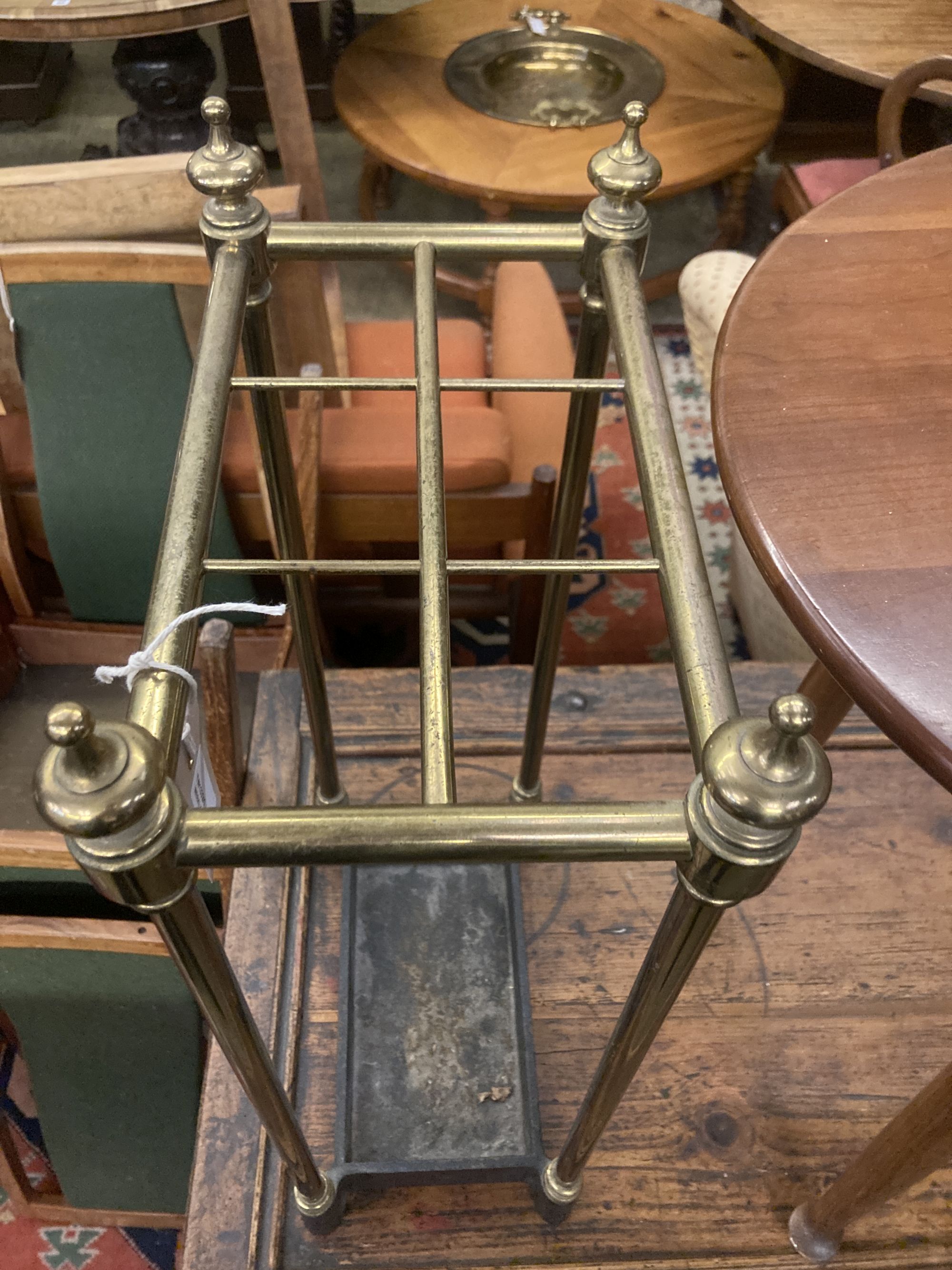 A Victorian brass and cast iron six division stick stand, width 32cm depth 19cm height 62cm